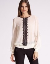 What to wear under this sheer blouse?