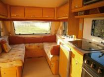Wanting to recover cushions in caravan...unsure of best colour to go with the wood