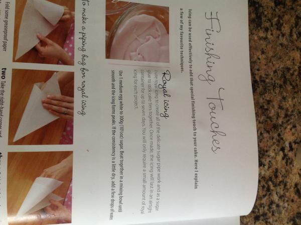 Sticking icing shapes on to fondant icing