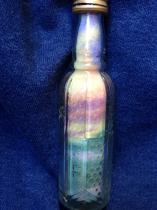 What can I do with lots of tiny pretty shaped glass bottles?