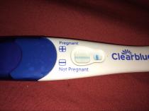 12dpo, possible implantation bleed, VERY faint line on Ic pregnancy test. Please look!