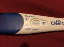 12dpo, possible implantation bleed, VERY faint line on Ic pregnancy test. Please look!