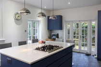 If you have a very large kitchen island unit, what's hanging above it?