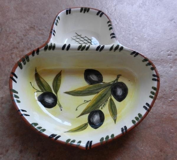 to wonder who on earth buys olives with the stones in and why?