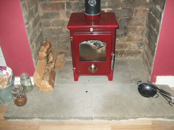 Hearth for a multi fuel stove - would white be a bad idea?