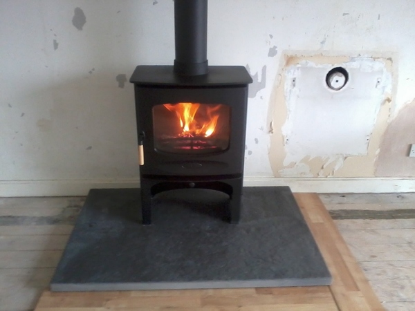 Hearth for a multi fuel stove - would white be a bad idea?