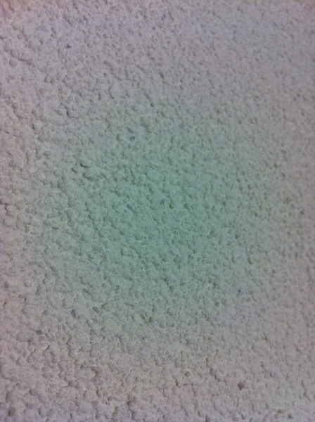 Sticking  pictures on pitted walls