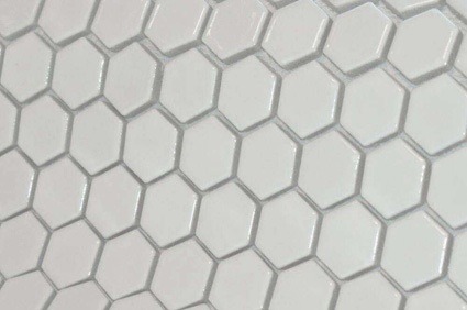 Which wall tiles in a bathroom with a patterned floor