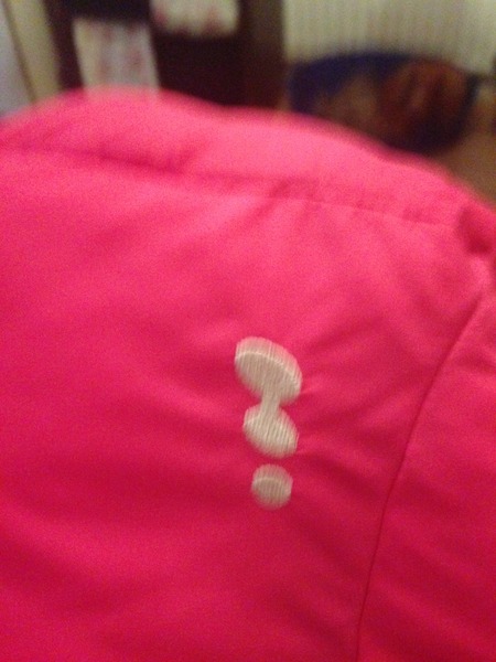 3 ovals logo on a child's coat