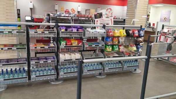 Post Office displaying Sweets in the queuing area.