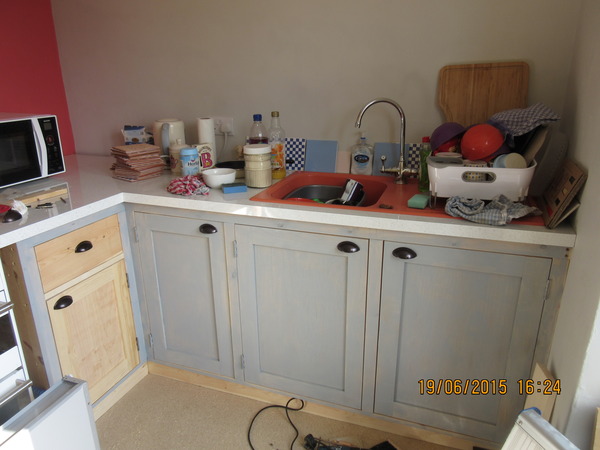 What can you store in a tiny gap next to the cooker?