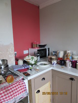 What can you store in a tiny gap next to the cooker?