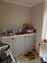 What can you store in a tiny gap next to the cooker?