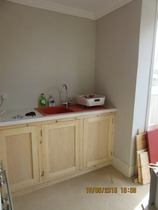 What can you store in a tiny gap next to the cooker?