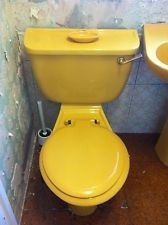 to keep a bright yellow bathroom suite?