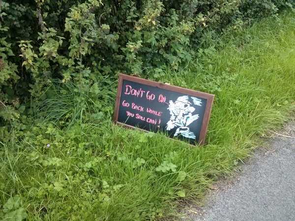 Overly threatening sign on public road