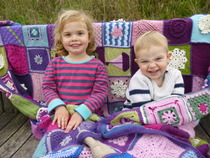 Woolly Hugs. For our own Beccajo. Lovely donors and crafters, please, your help is needed.