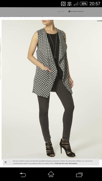 Style this sleeveless jacket