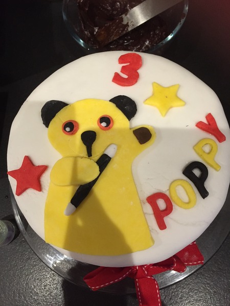 Icing a birthday cake