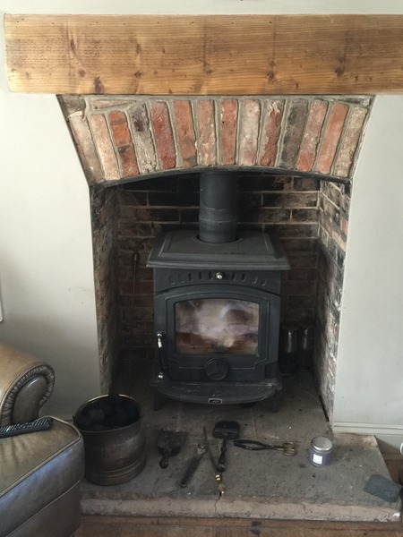 Crappy fireplace with log burner (photo included) - is this quote to improve it realistic?
