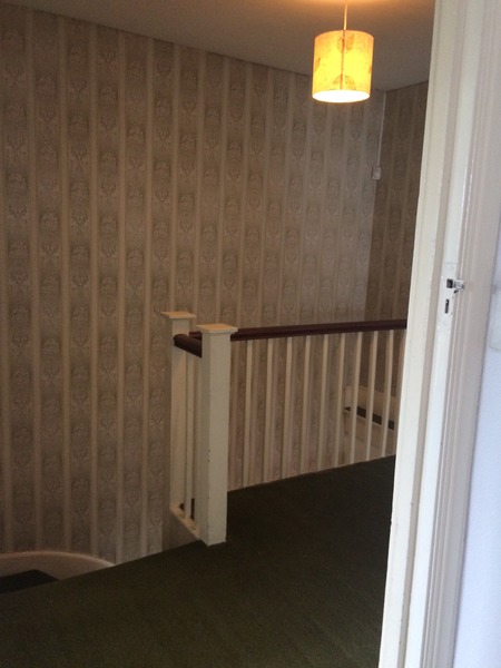 What happens when the top of a stair runner meets the landing?