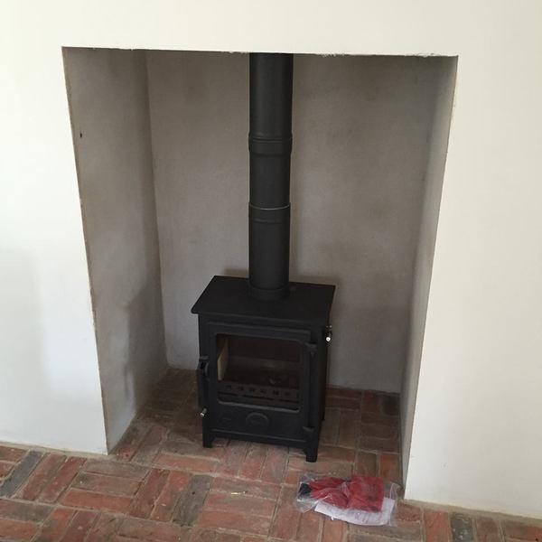Crappy fireplace with log burner (photo included) - is this quote to improve it realistic?