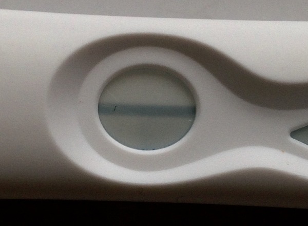Can anyone see a cross symbol on this pregnancy test?