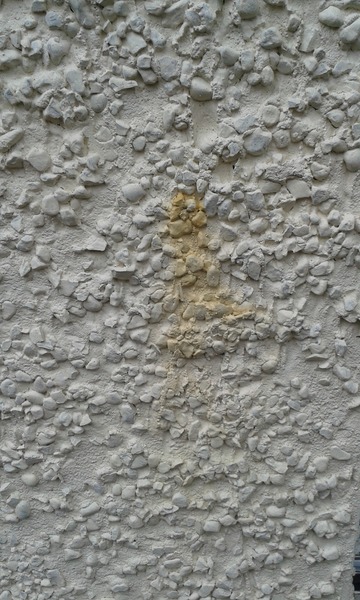 Iron stains on new painted pebble dash? Pic