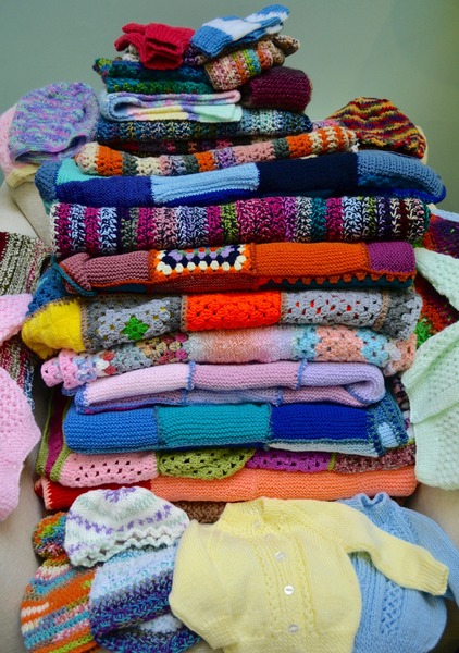 Woolly Hugs. Our Project to help refugees continues. One square, one blanket, a pair of gloves, one warm hat, one step at a time, really every little thing will help. All support welcome.