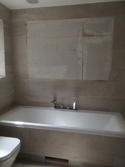 Photos of 2 new bathrooms