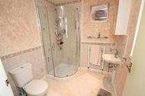 Would you make a shower room smaller to make the room next to it bigger? Photos included.