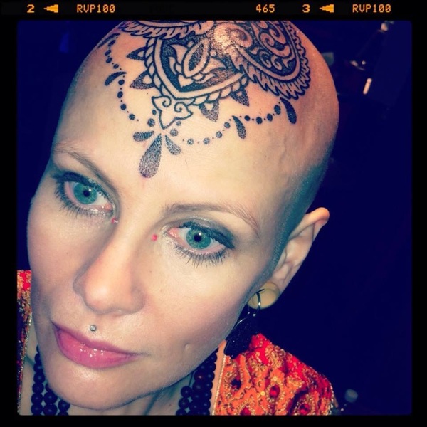 to have gotten matching head tattoos with DH?
