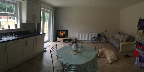 How can I (cheaply) make this large, bland space more cosy?