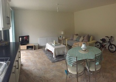 How can I (cheaply) make this large, bland space more cosy?