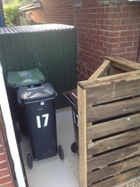 Neighbours new bin port - crossing our boundary ? Can anyone help with advice please ?