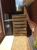 Neighbours new bin port - crossing our boundary ? Can anyone help with advice please ?