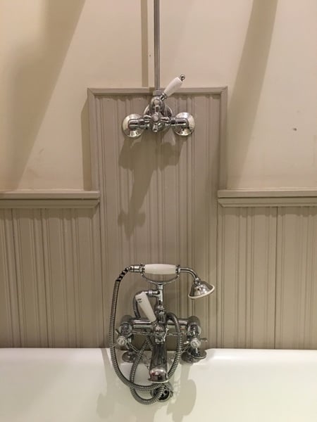 Awkward bathroom - can you have taps in the middle AND an over bath shower?