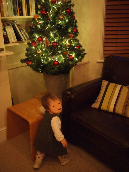 Christmas tree and crawling baby.
