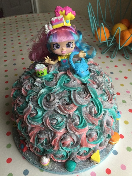 AIBU to serve up a cake that has contact glitter on it instead of edible?