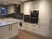Contemporary kitchen with black worktop on island