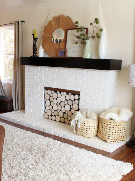 What do put under faux fireplace mantel...