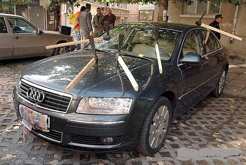 Blocking neighbour's car with bins