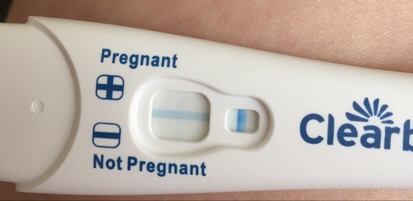 Faint positive clear blue pregnancy test ??