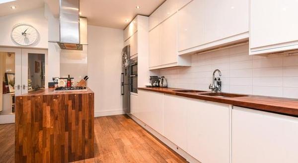 Is a real wood work surface in a kitchen a really bad idea?