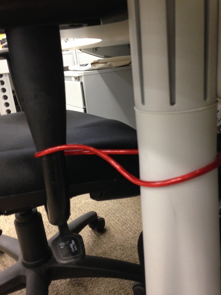 Colleague leaves chair in the aisle - WIBU to hide it?