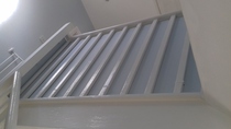Can anyone recommend a stair guard to stop a crawling baby falling between balusters?