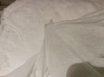 Odd non fabric 'material' that covers the wadding in a cushion?