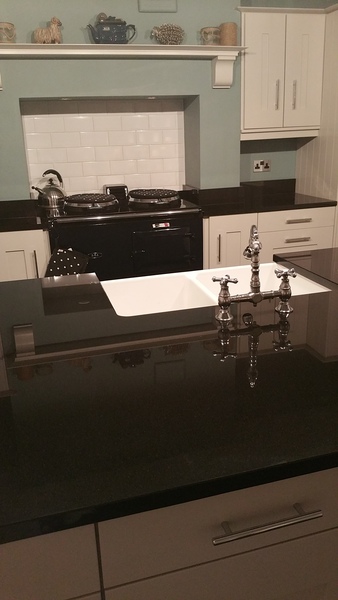 Can anyone show me their dark stone worktops please