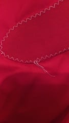 Sewing machine stitches showing good side on wrong side