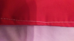 Sewing machine stitches showing good side on wrong side